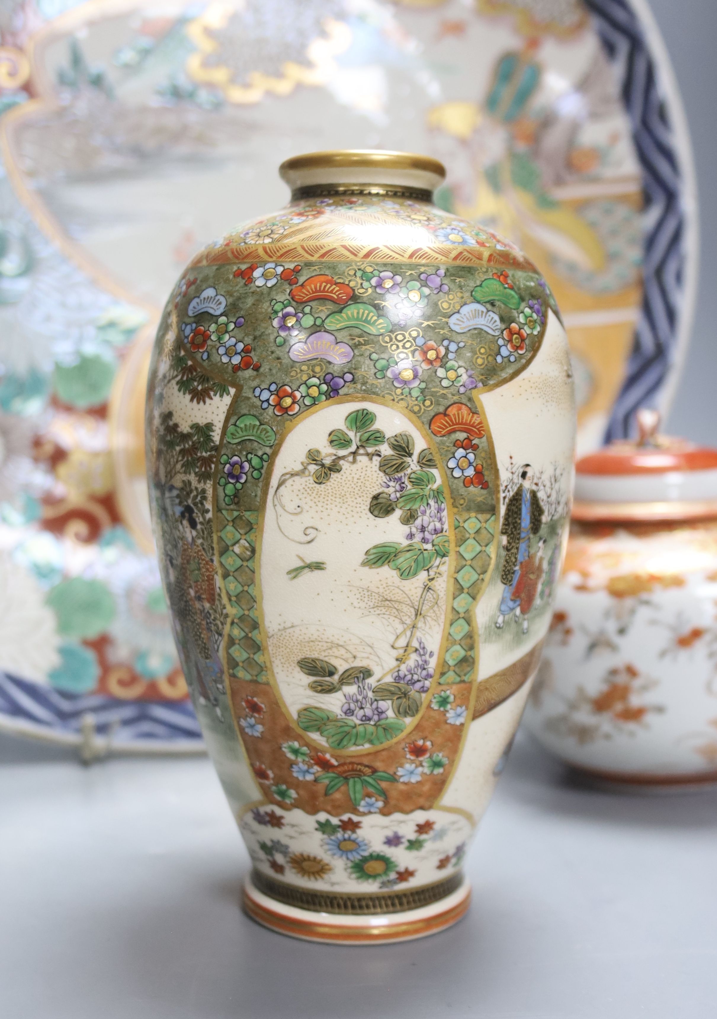 A Japanese Imari charger, a Kutani jar and cover and a Satsuma vase, diameter 40cm